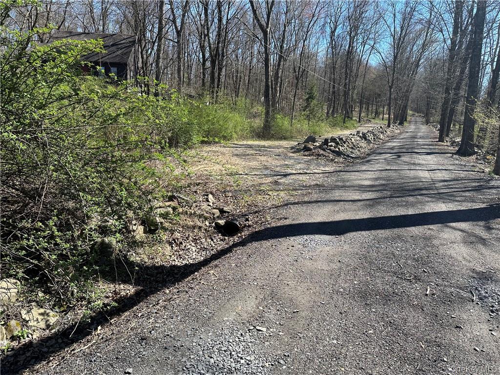 Entrance to the driveway on left