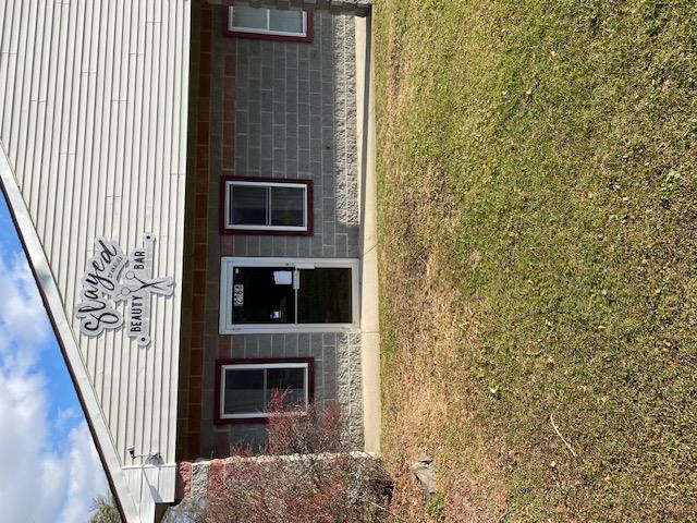 Entrance to property with a yard