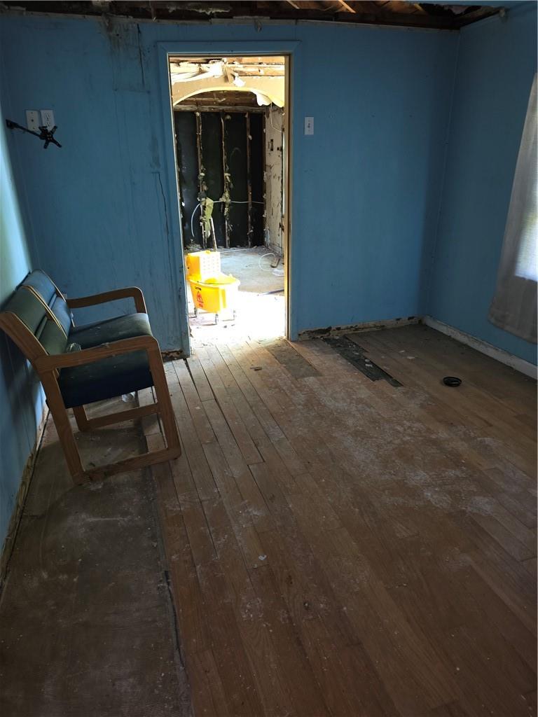 Unfurnished room featuring wood-type flooring