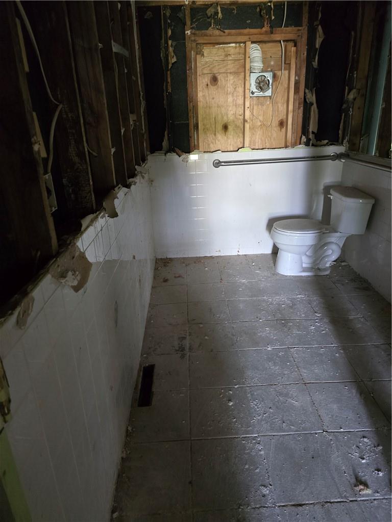Bathroom with tile flooring and toilet