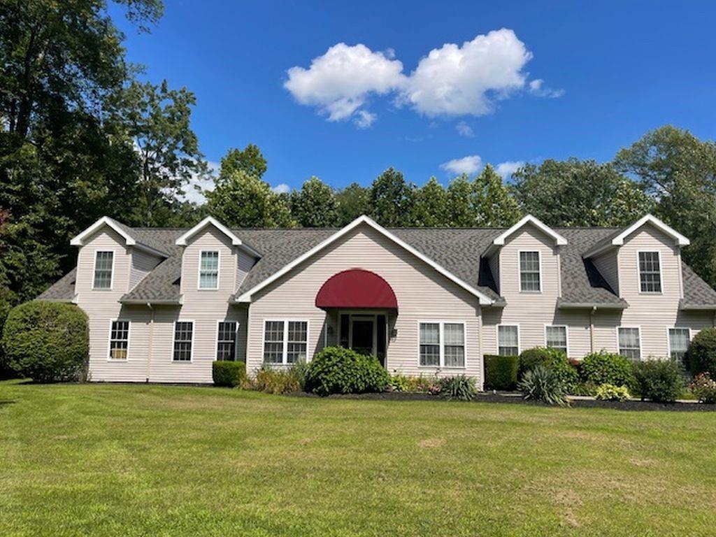 View of front of property with a front lawn