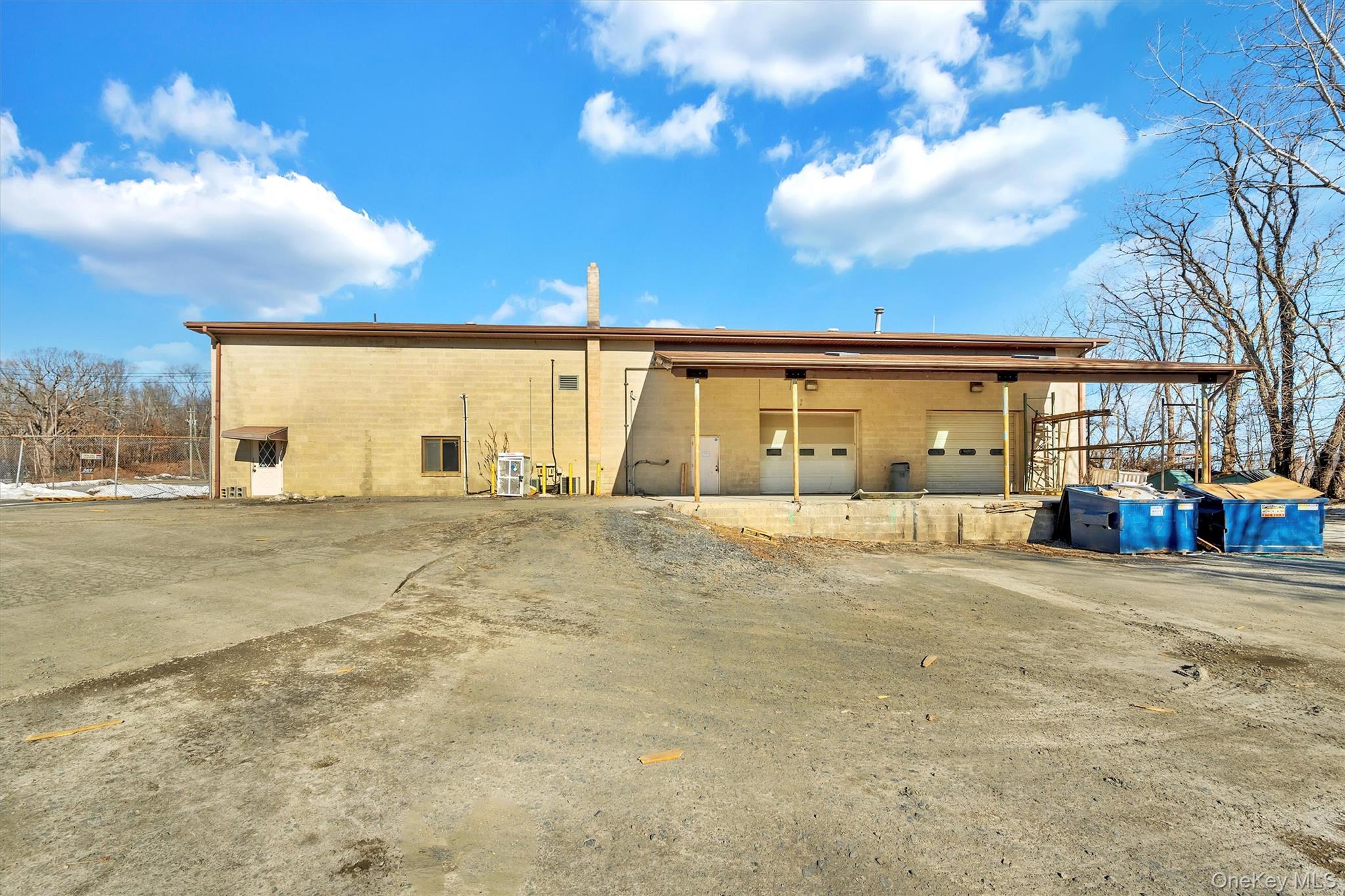 Rear view of house featuring a carport