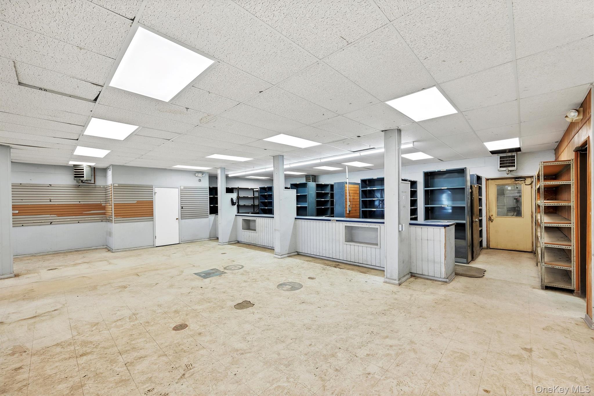 Basement with a paneled ceiling