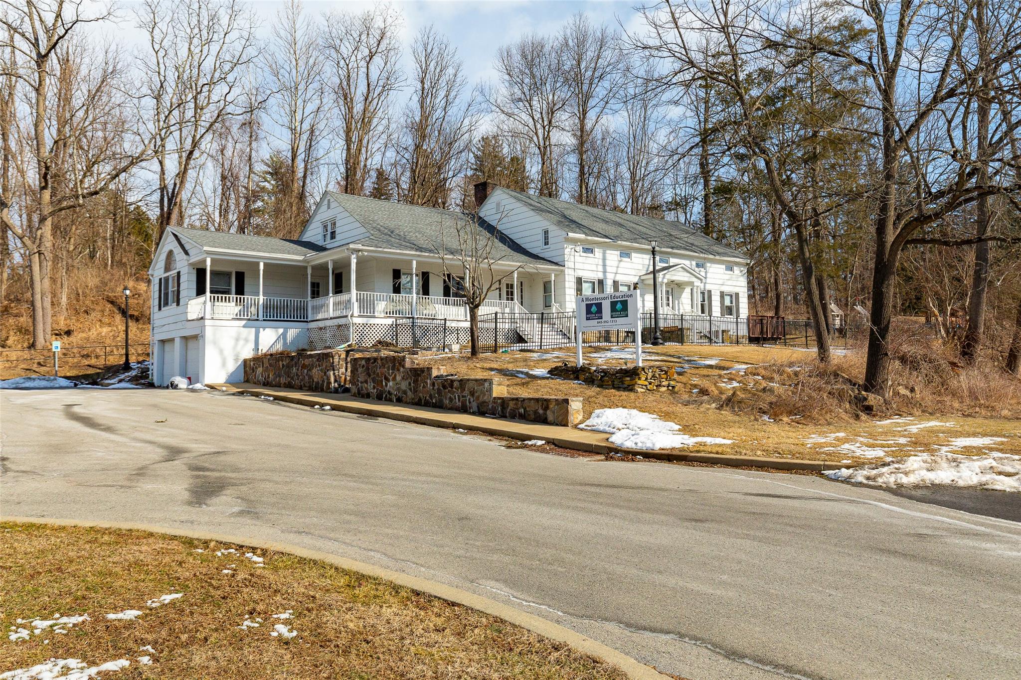 View of front facade with a garage and covered porch