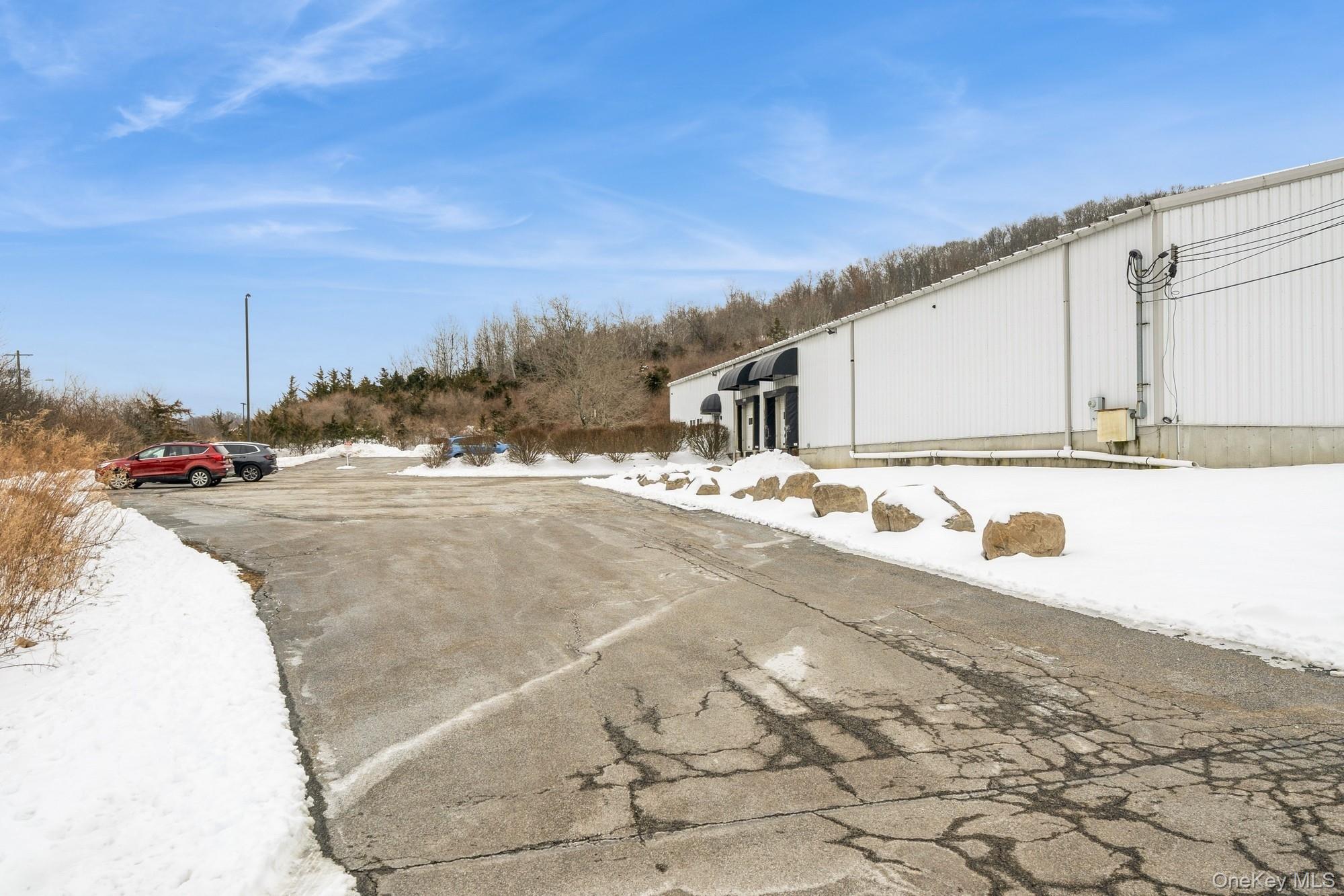 View of entry and parking area