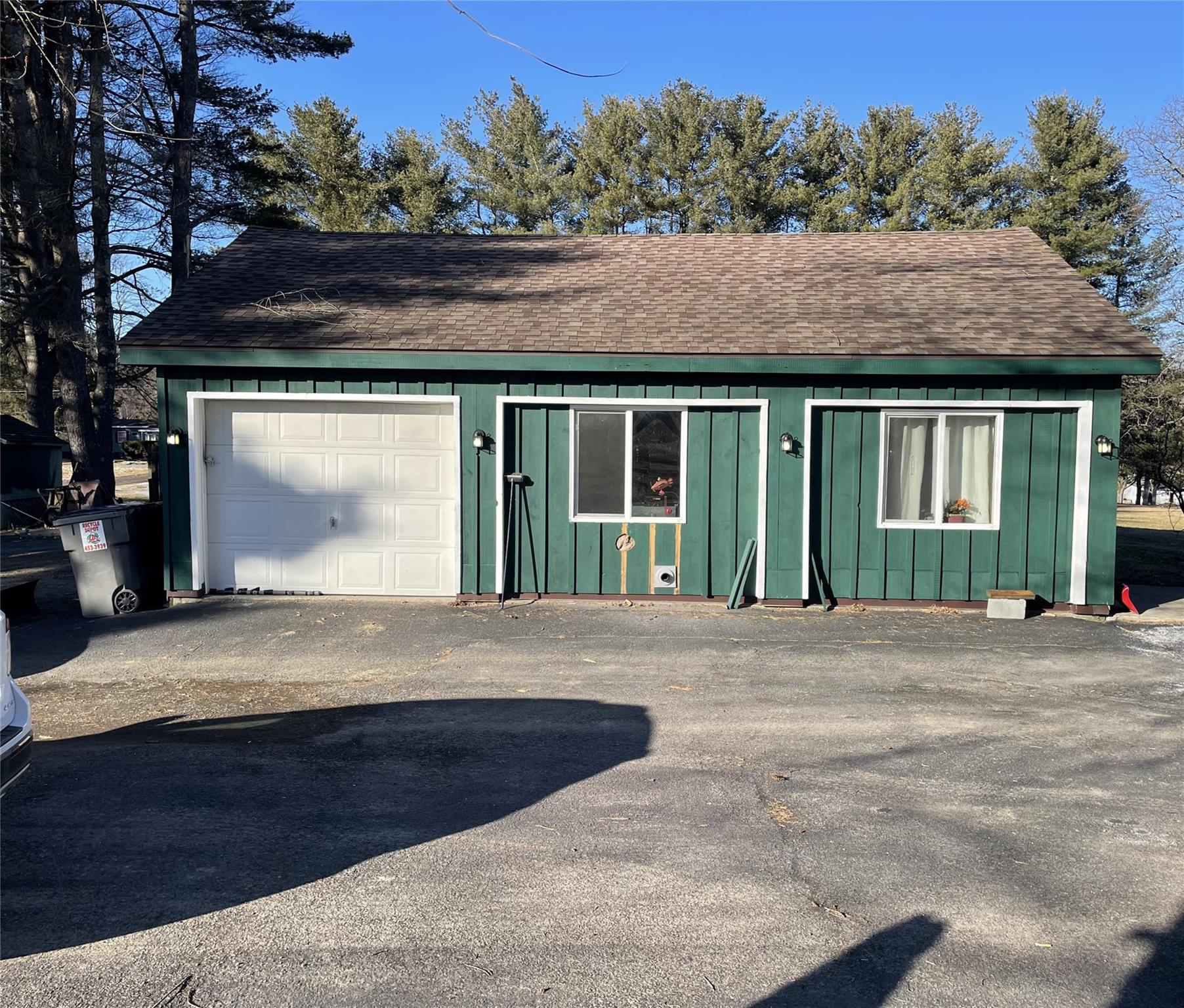Garage featuring driveway