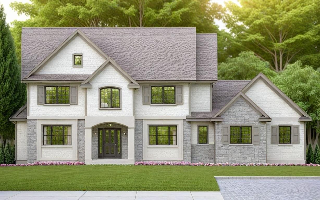 View of front facade featuring a shingled roof and a front lawn