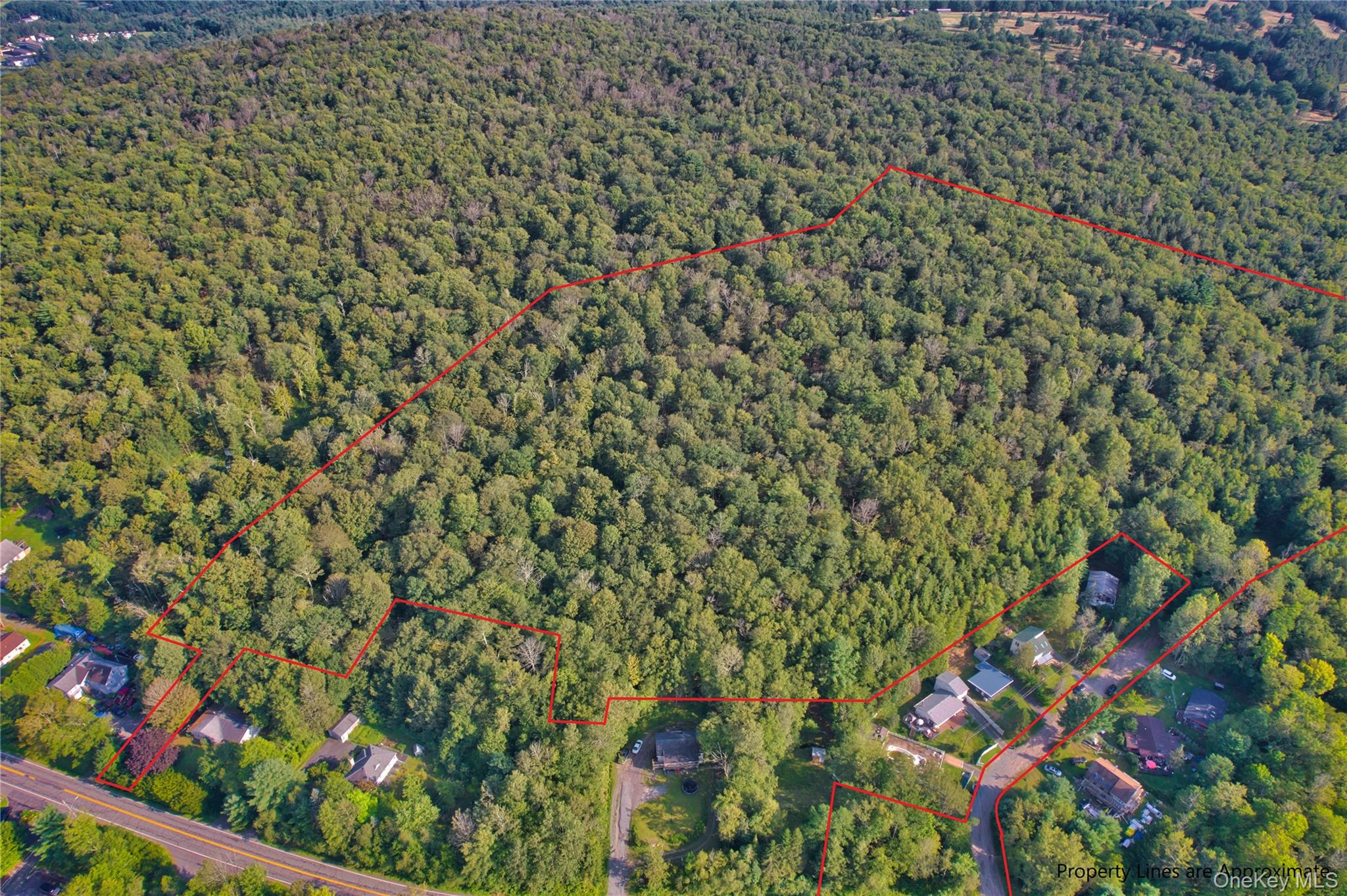 Aerial view of property's location featuring property parcel outlined