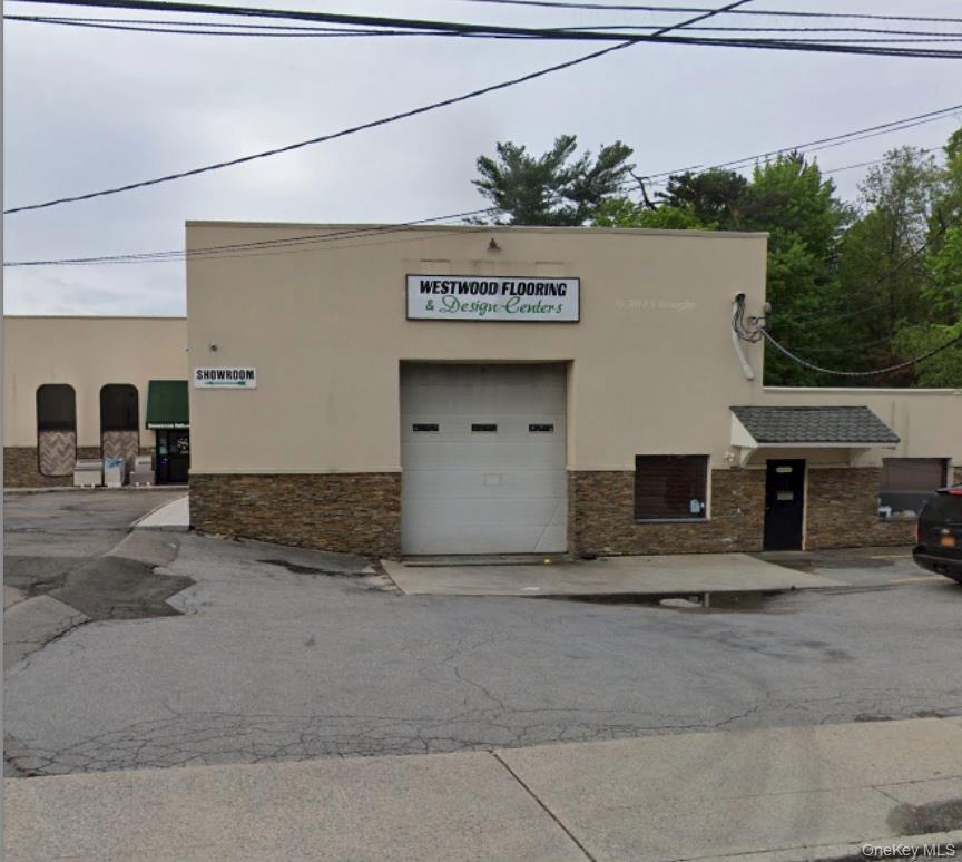 View of property featuring a garage