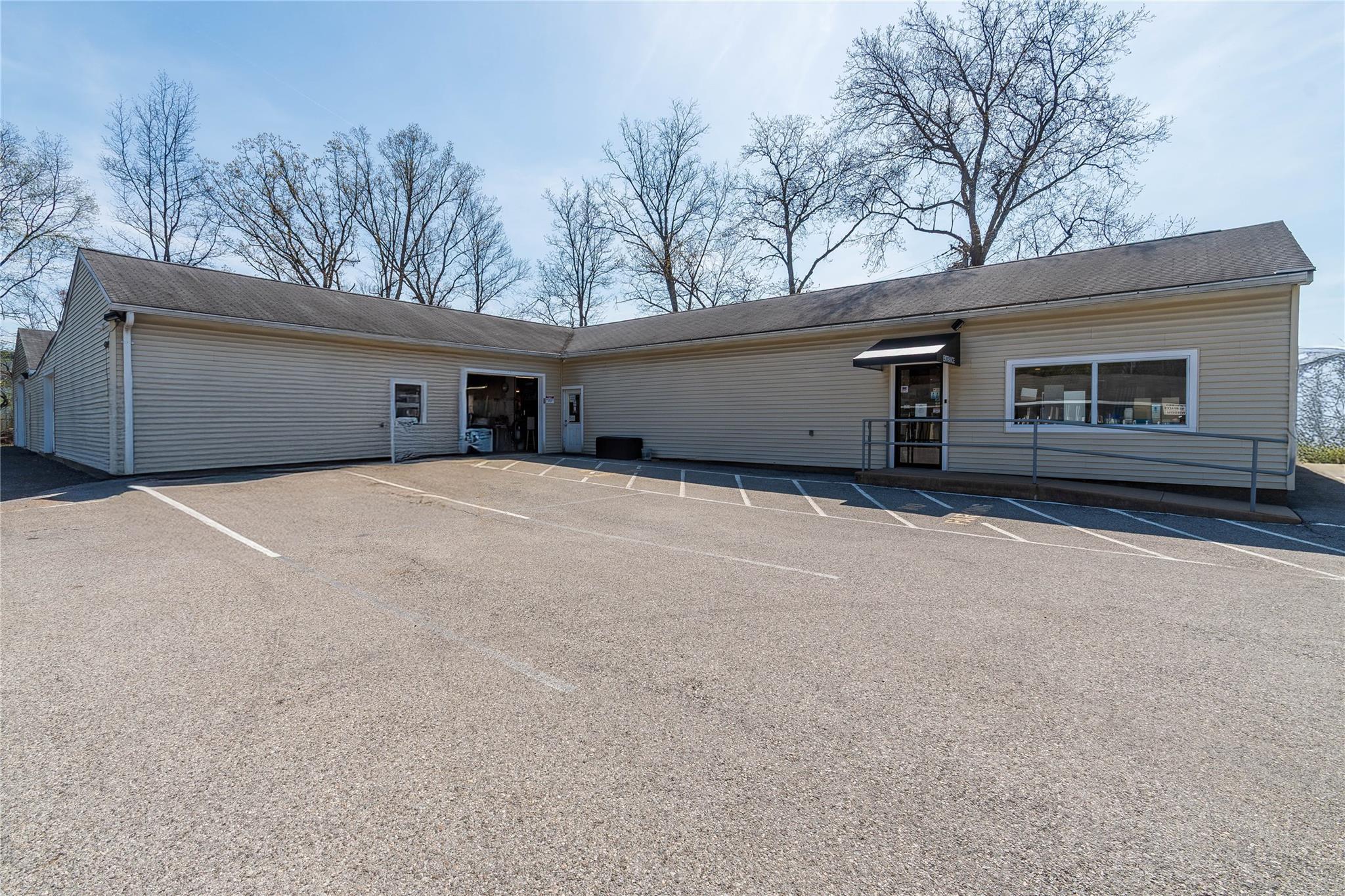 Ranch-style building Sherwood tile and parking
