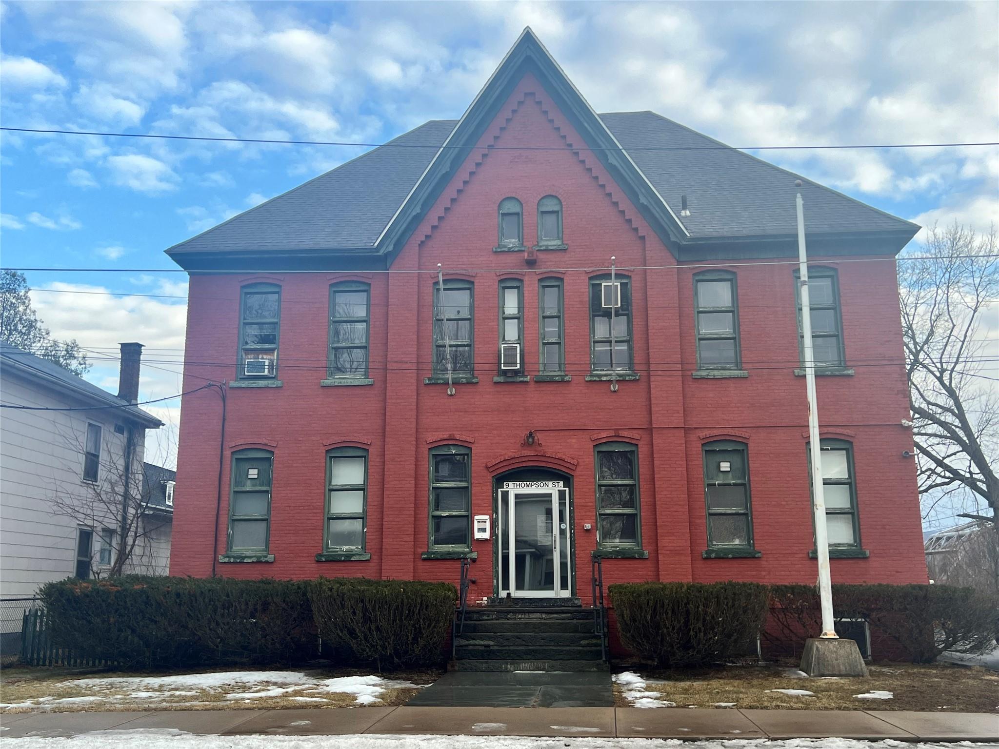 View of front of house with brick siding