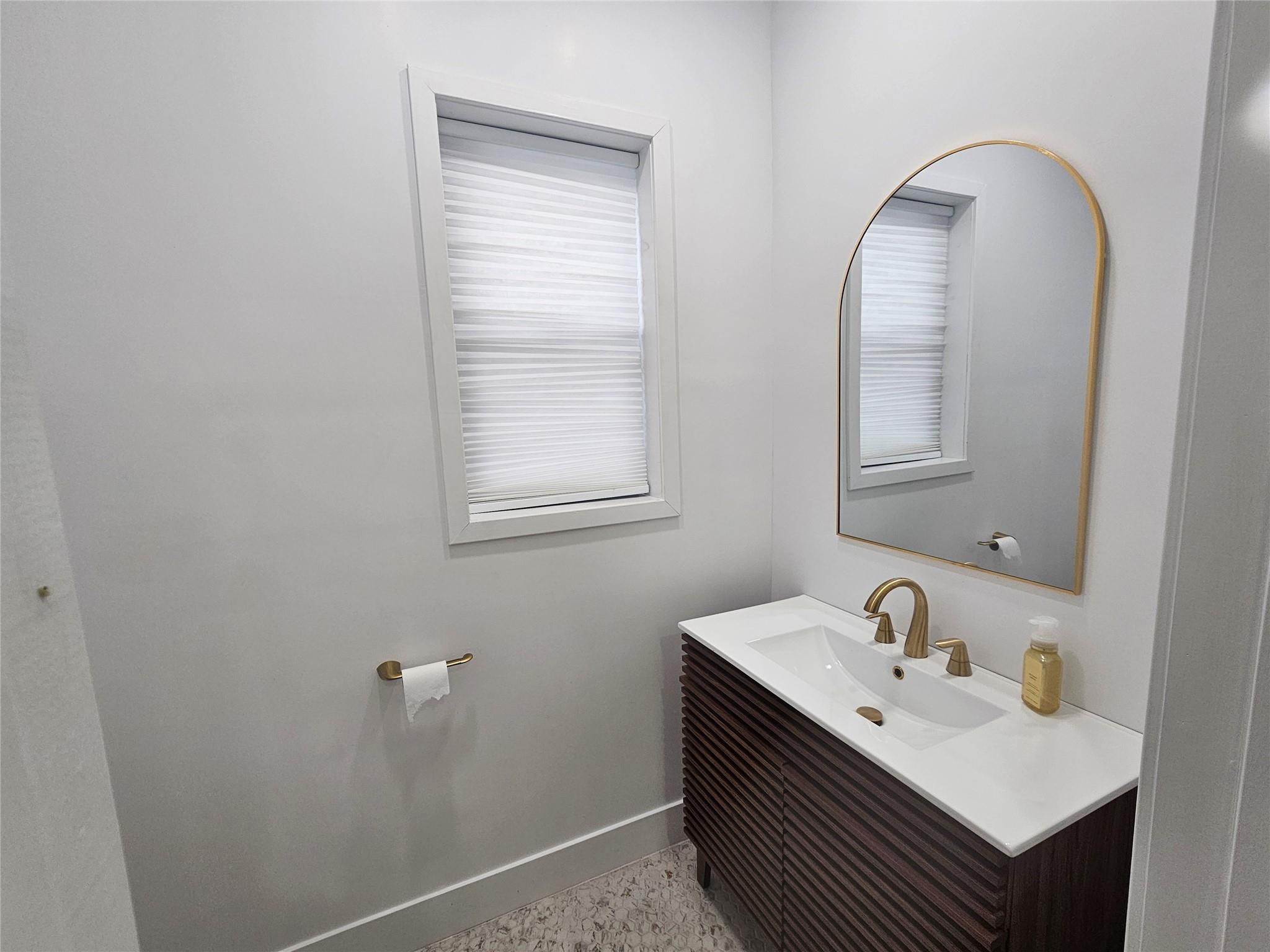 Bathroom with baseboards and vanity