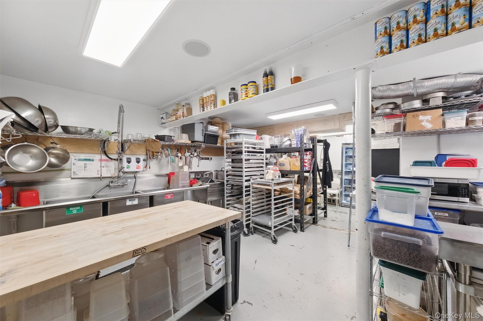 Miscellaneous room with finished concrete floors