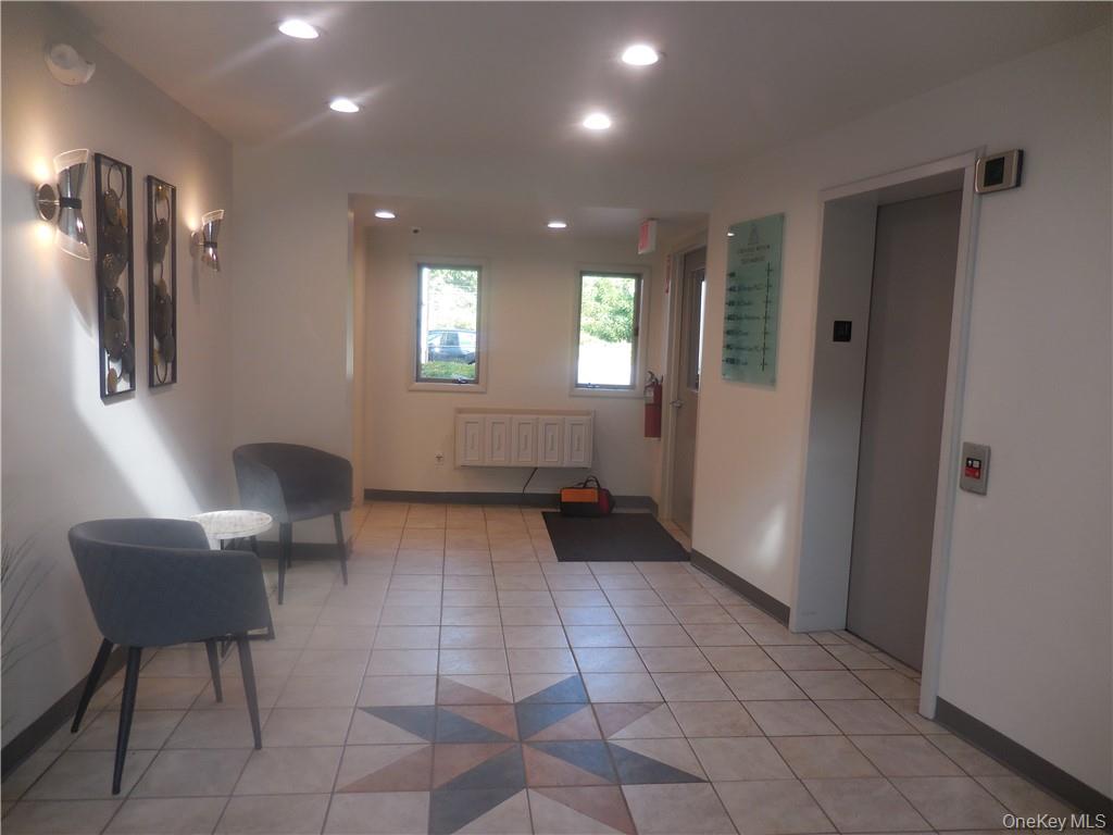 Lobby of the building with the elevator.