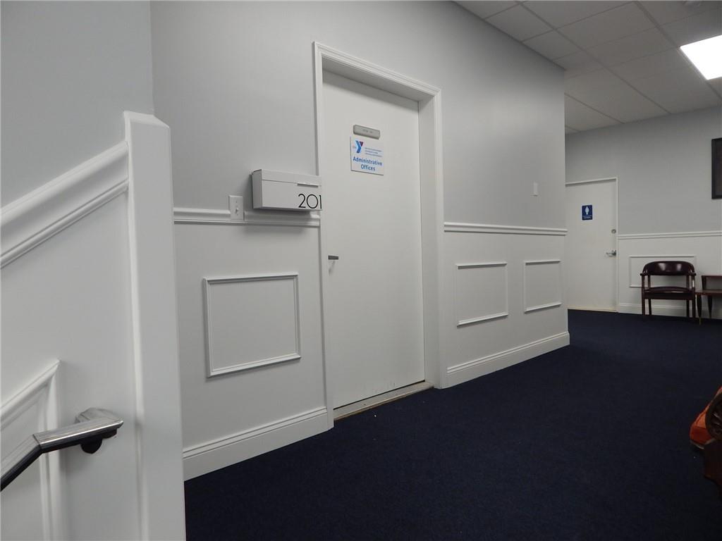 First door to the left at the top of the staircase.