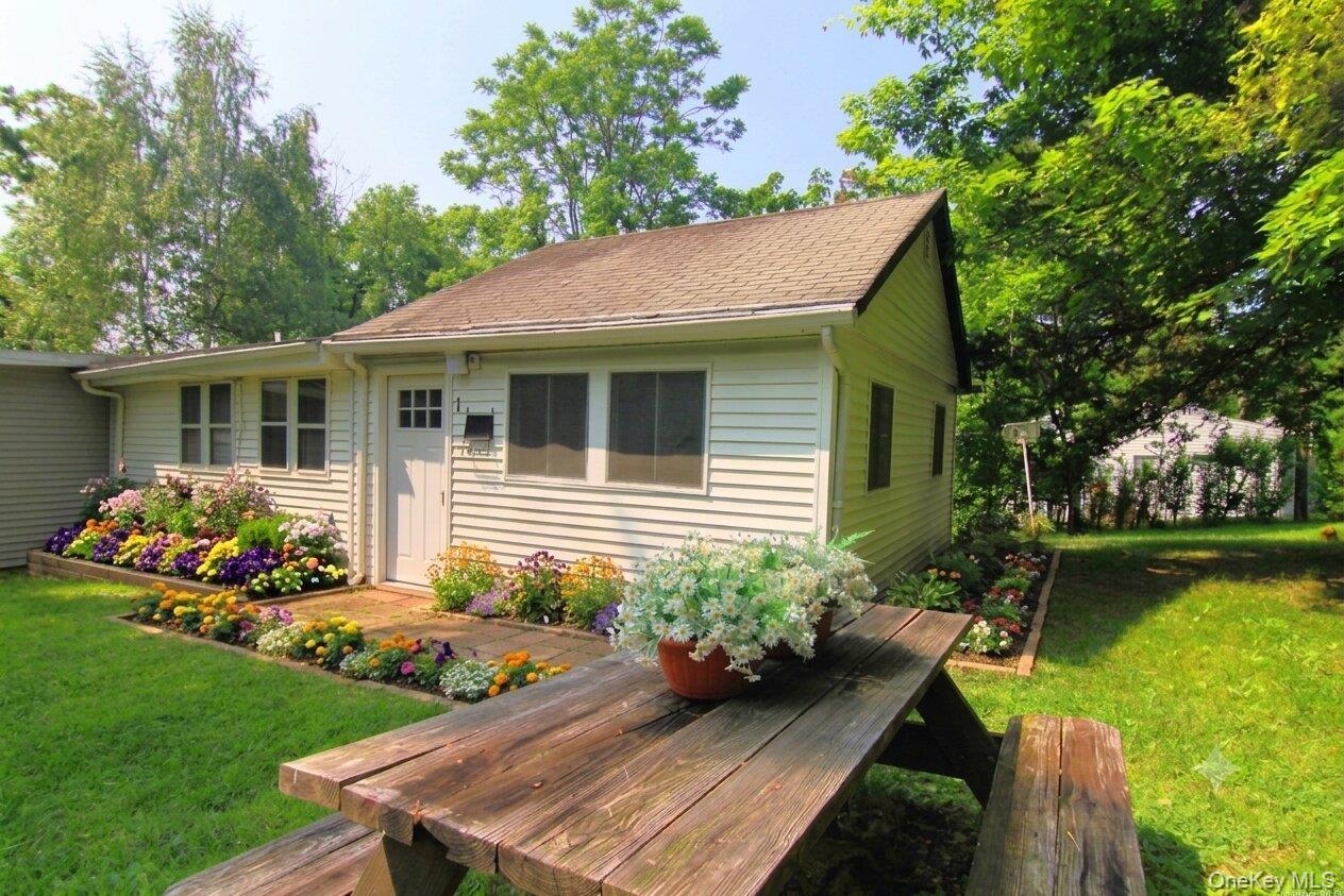 AI rendering of home with flower beds added