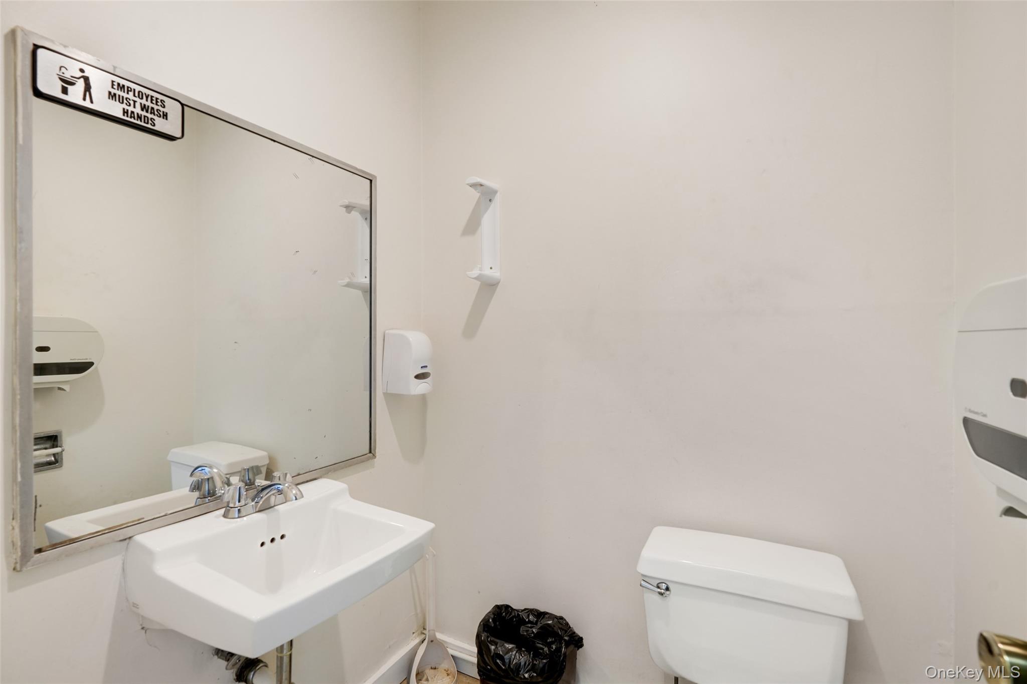 Bathroom featuring toilet and a sink