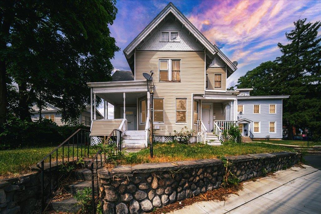 Victorian-style house featuring covered porch