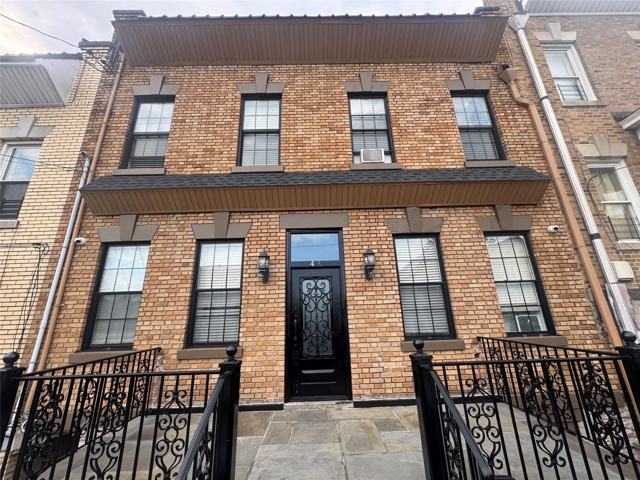 Entrance to property with brick siding