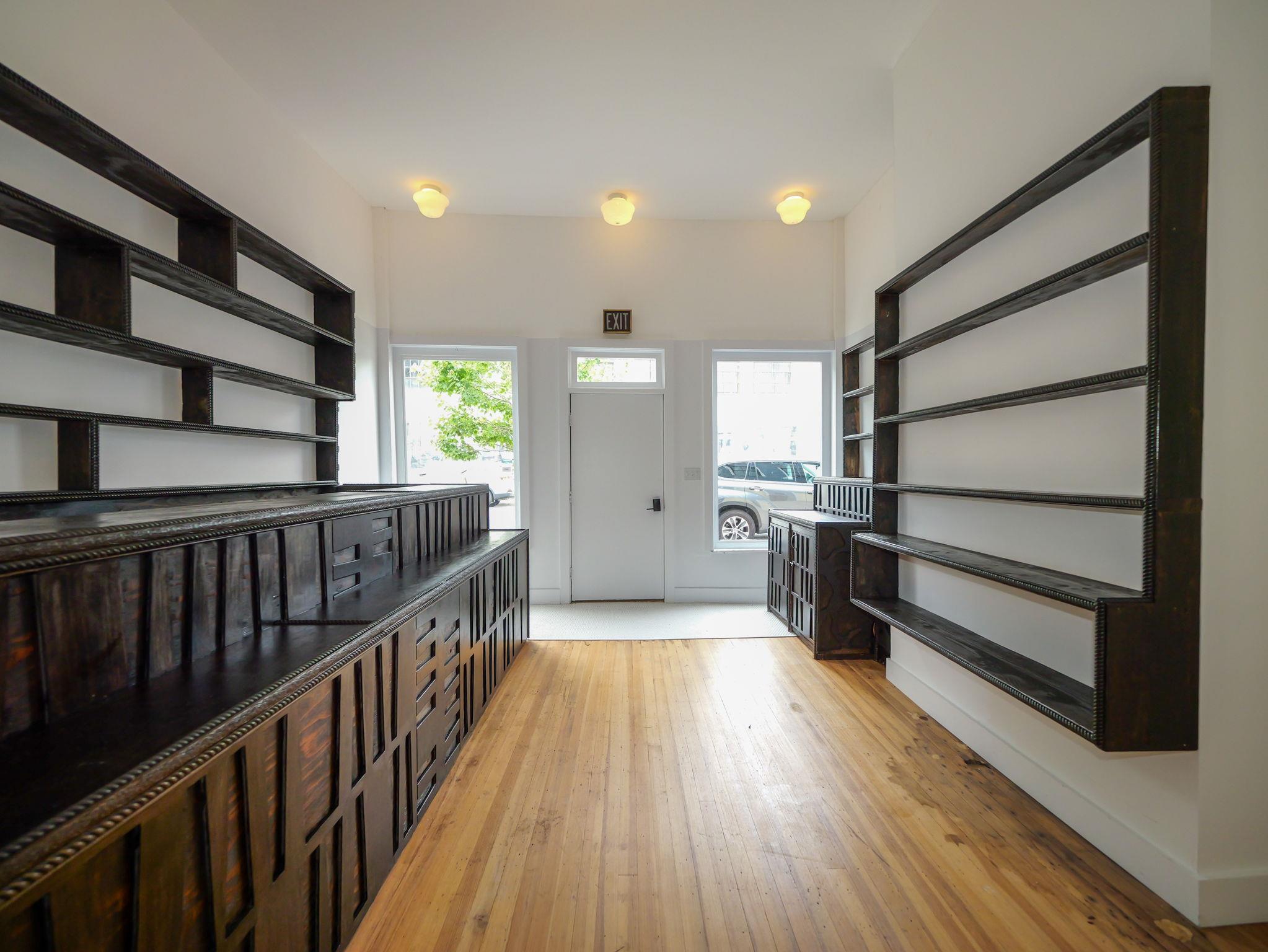 Storefront space with light wood-style flooring