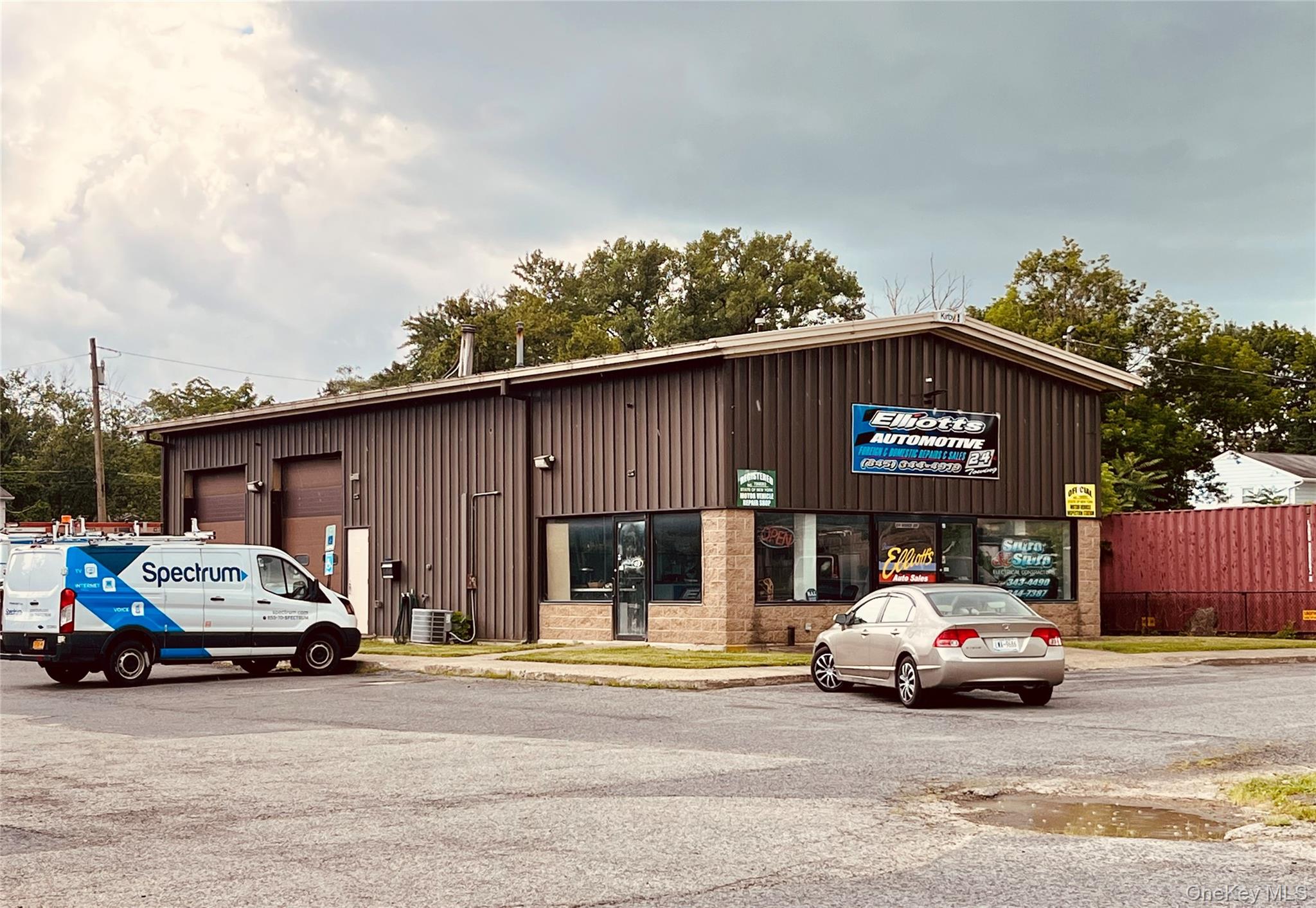 View of building exterior featuring a garage
