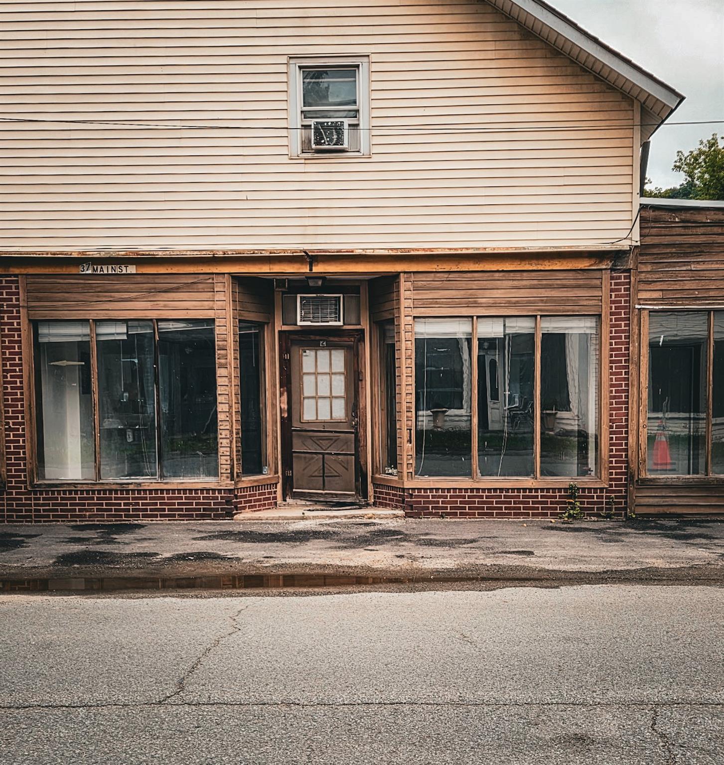 Doorway to property with brick siding