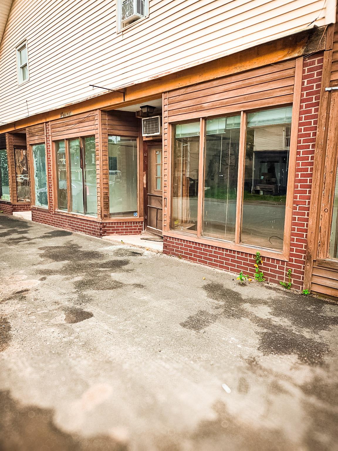 Doorway to property with brick siding
