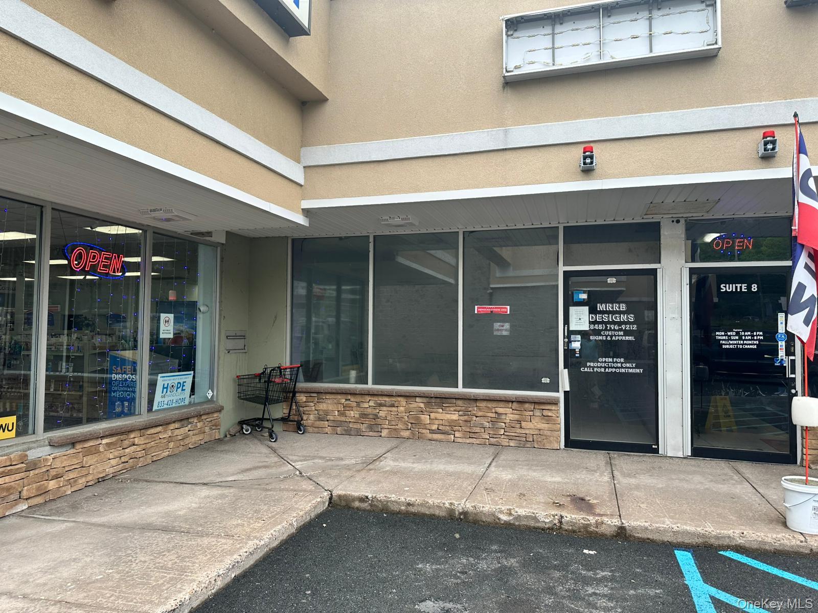 Property entrance featuring stone siding and stucco siding