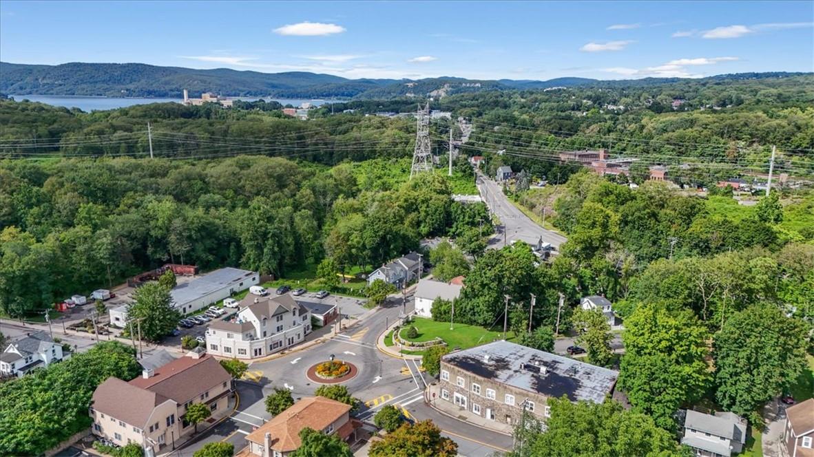 Birds eye view of property with a mountain view