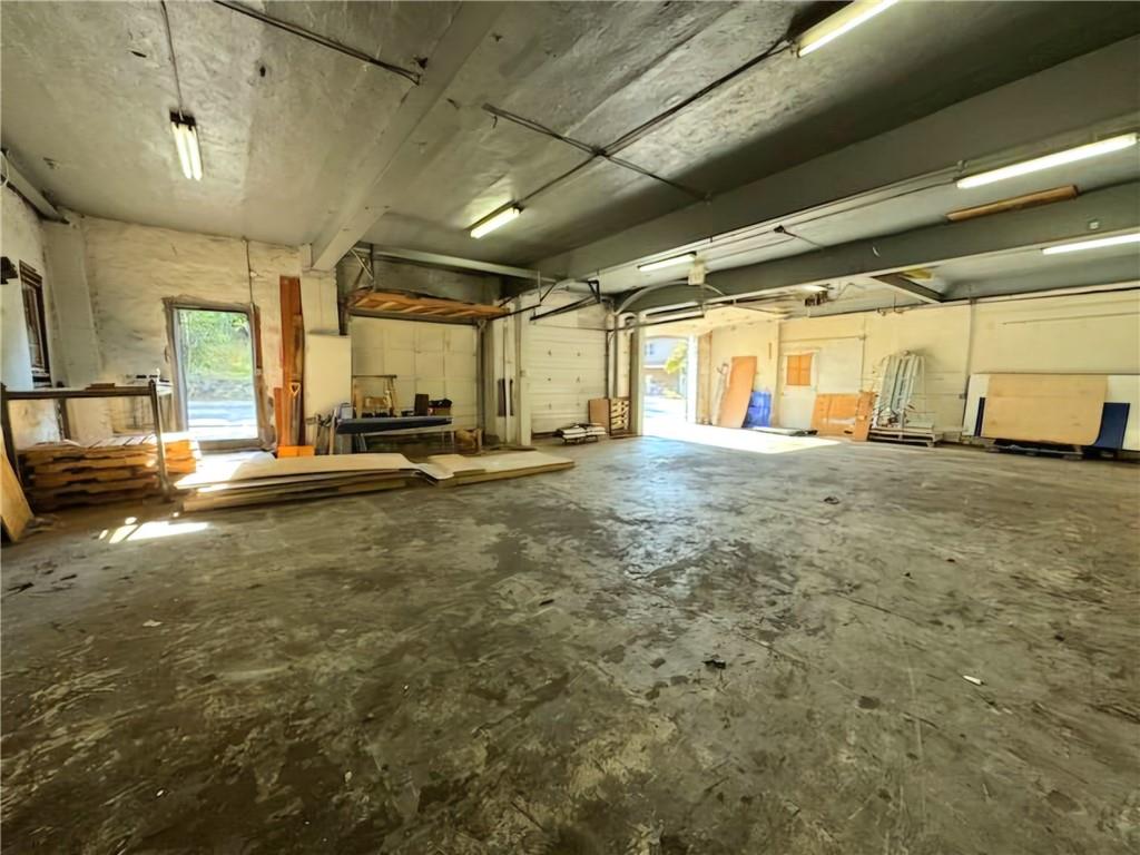 Miscellaneous room featuring concrete flooring