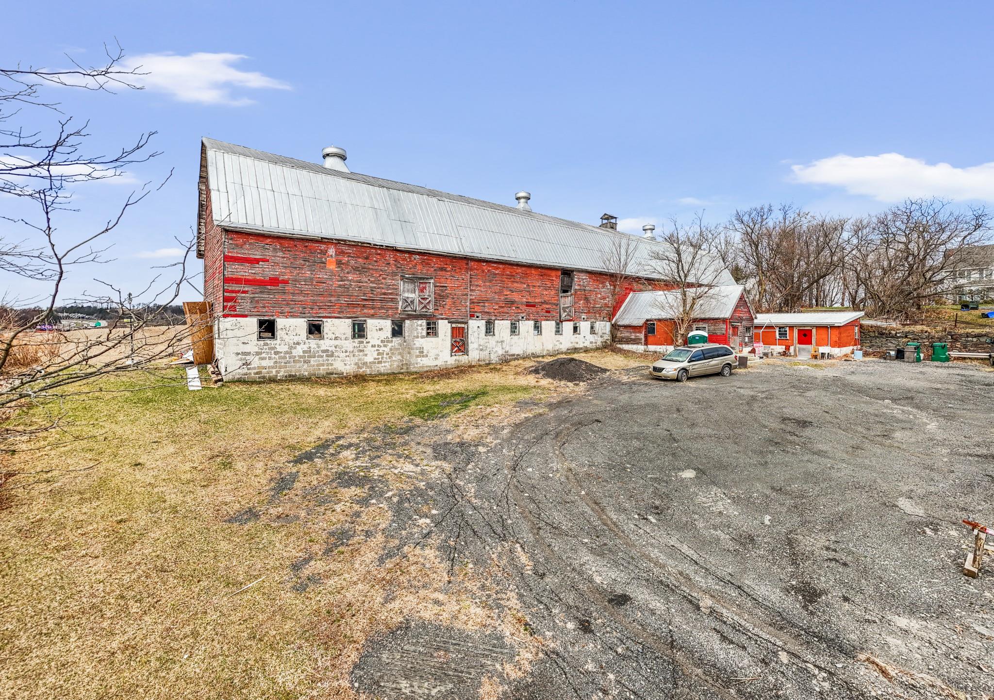 View of building exterior featuring a barn