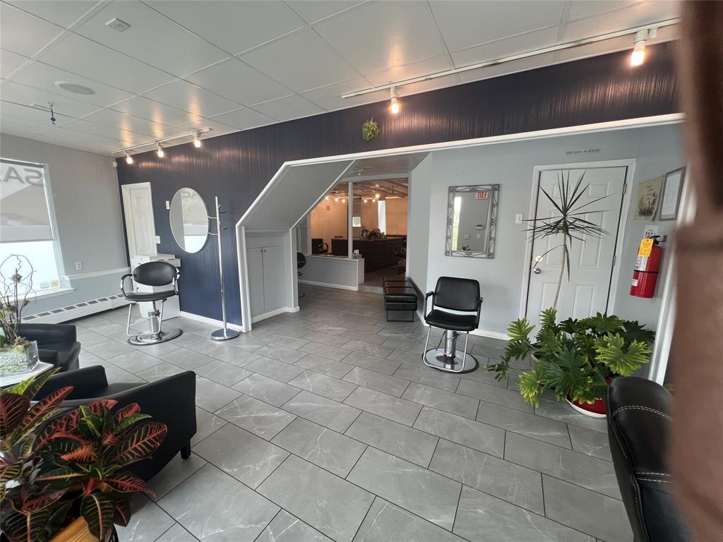 View of building lobby, reception area, pedicure manicure area 3