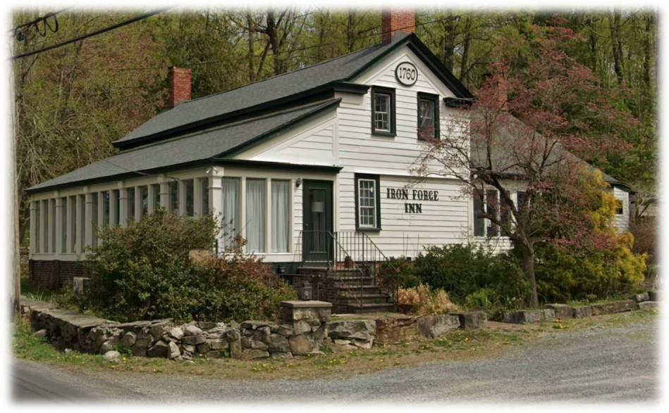 View of front of property with a chimney
