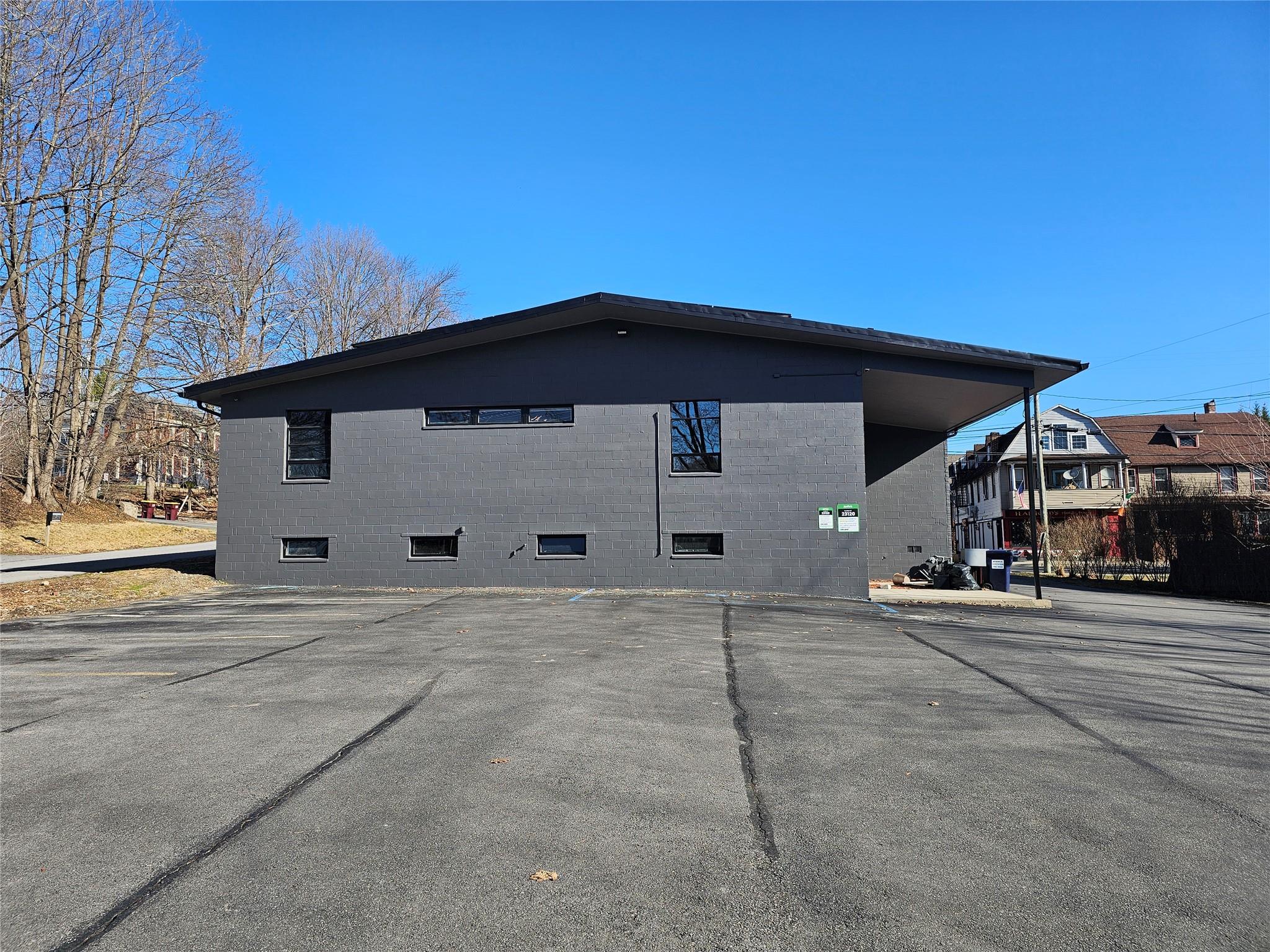 View of side of home with concrete block siding