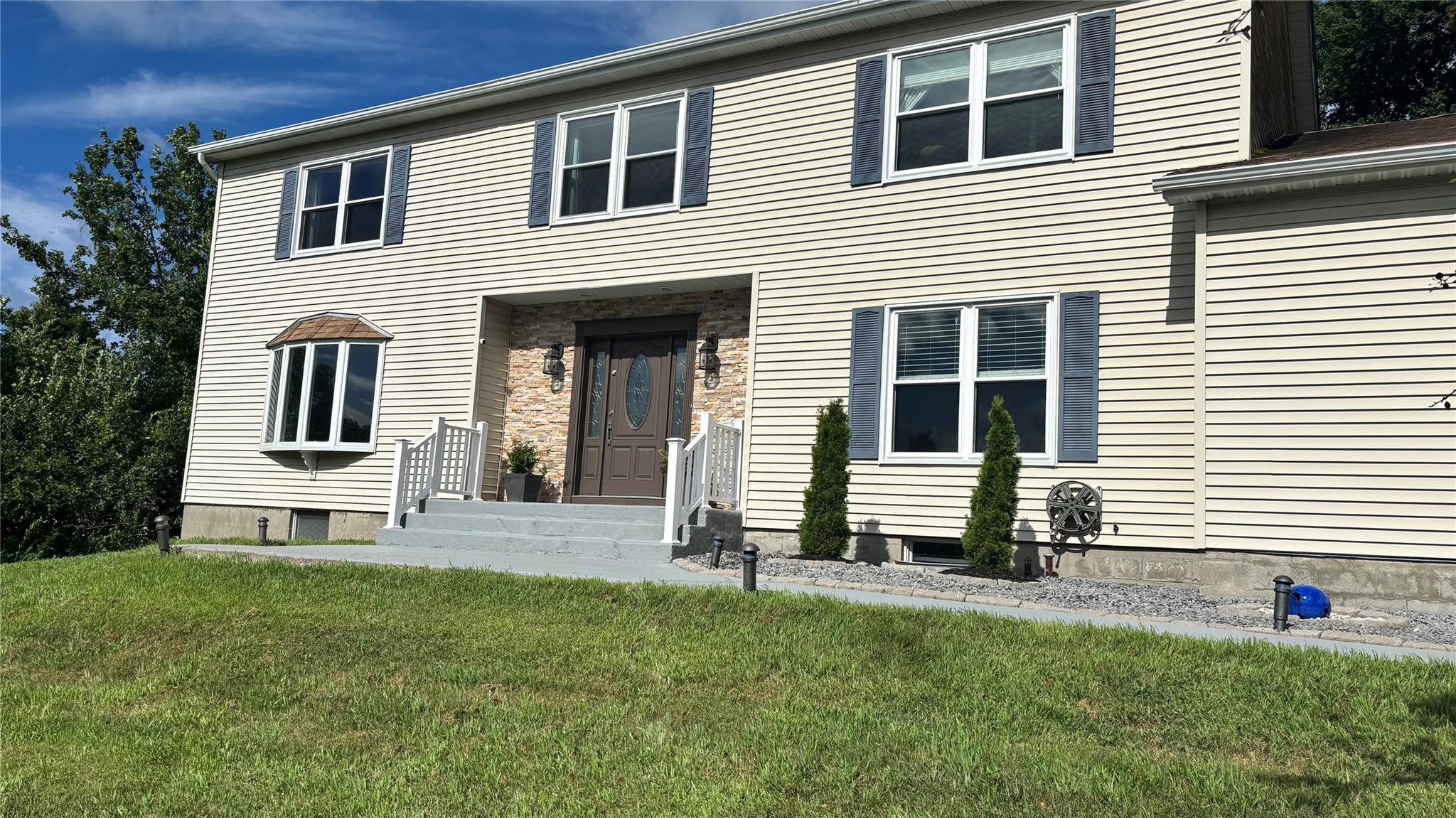 View of front of home featuring a front lawn