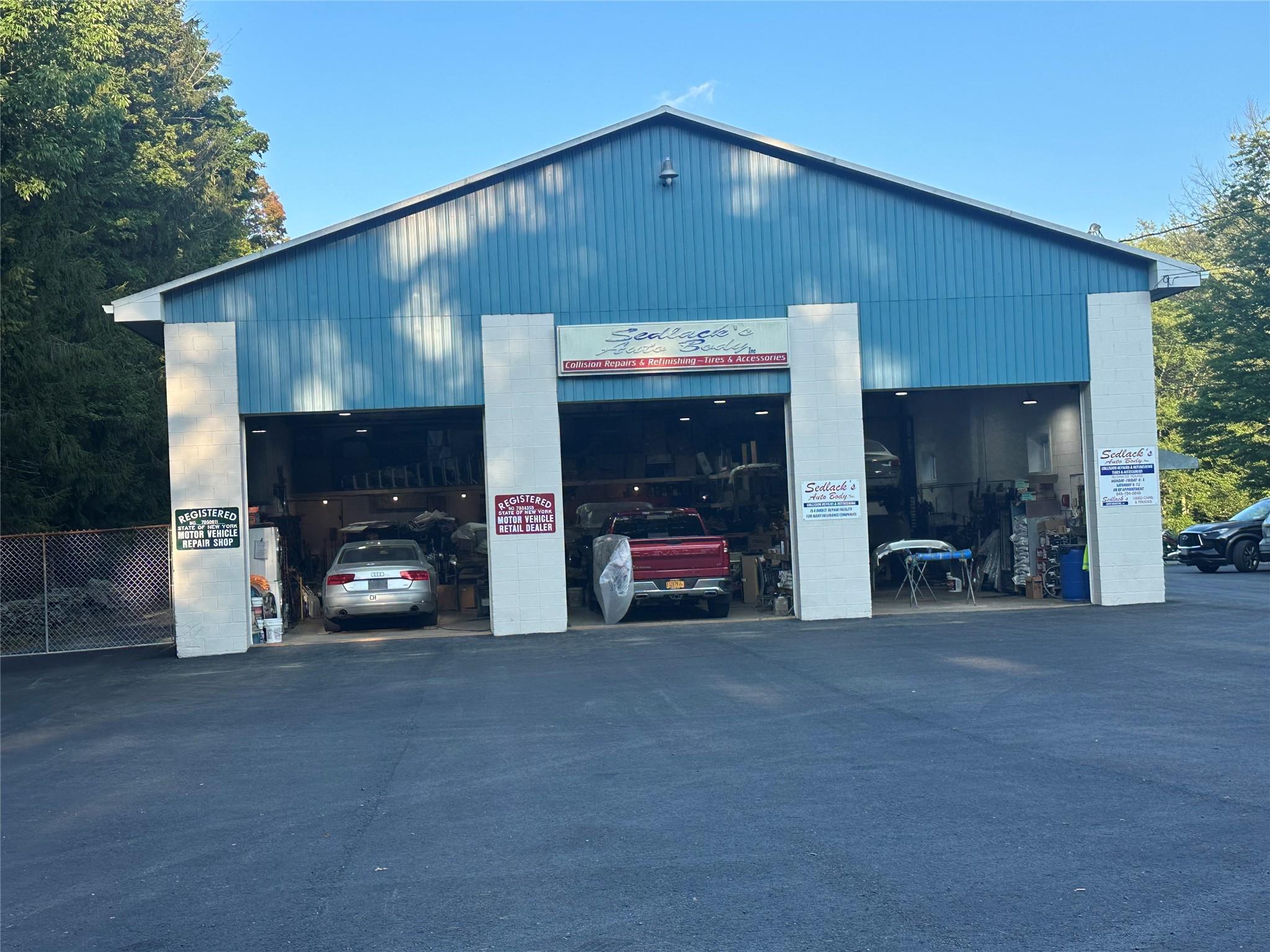 View of commercial location featuring a detached garage
