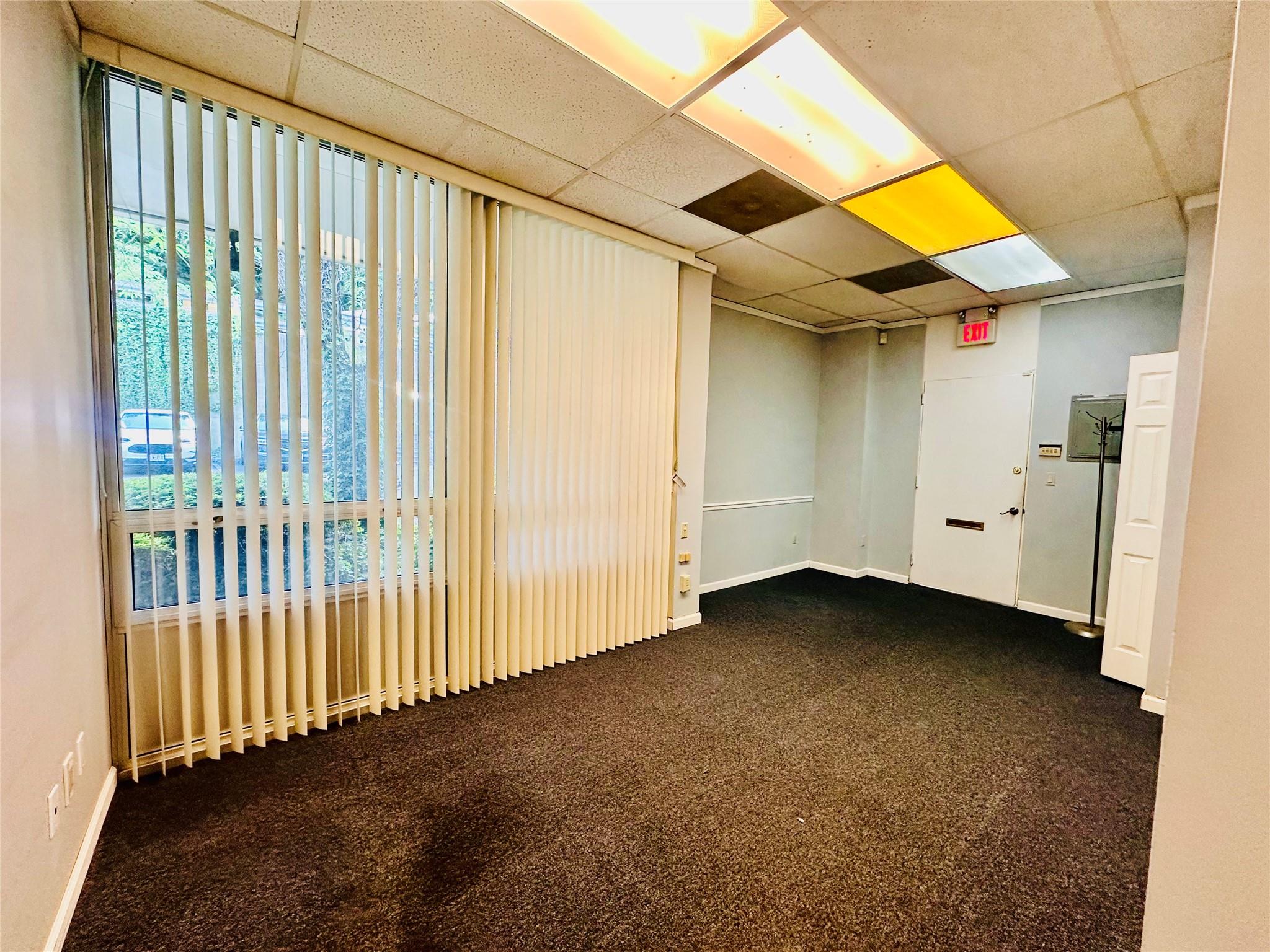 Empty room with a paneled ceiling