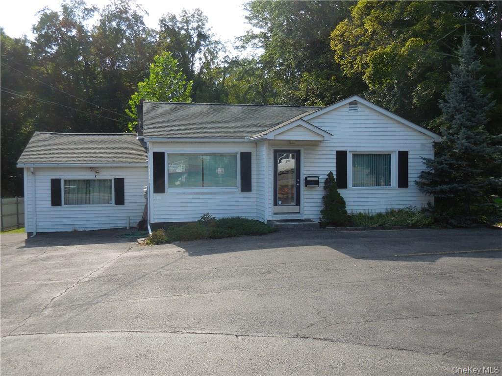 View of front of property featuring a shingled roof