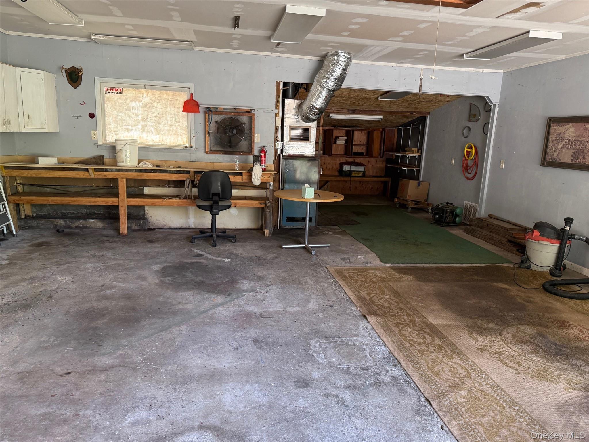 Garage featuring a workshop area