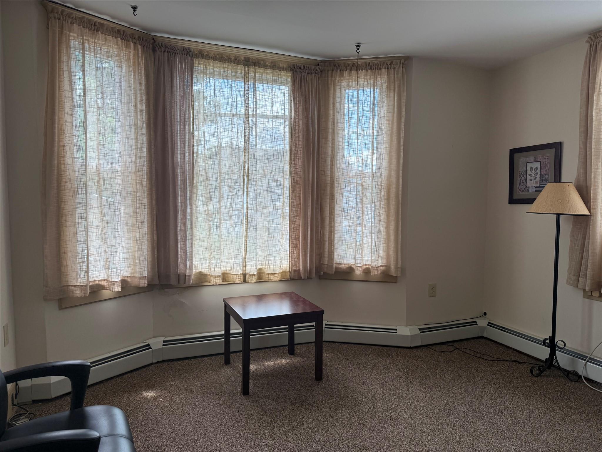 Unfurnished room featuring healthy amount of natural light