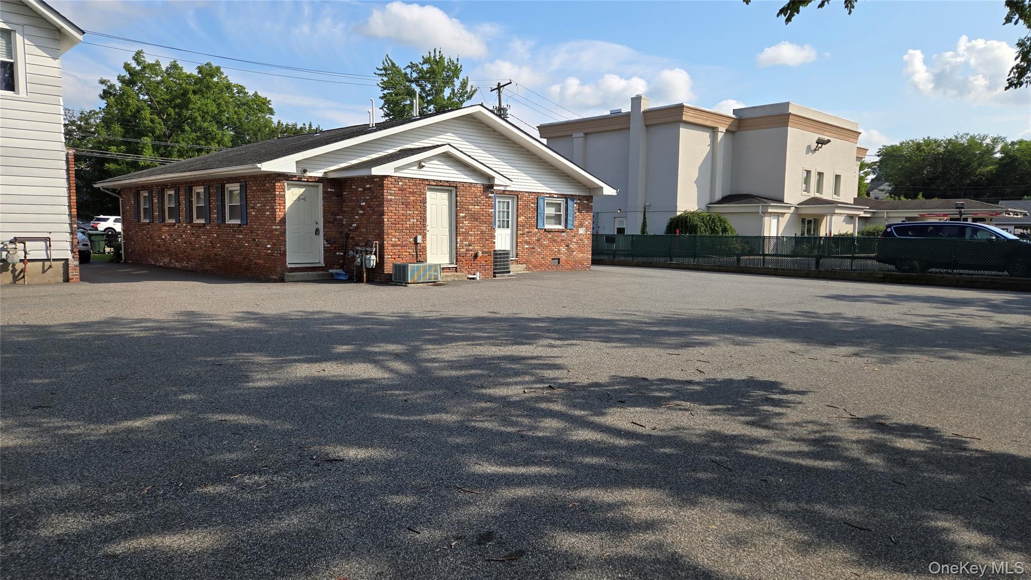 View of back of house featuring brick siding and entry steps