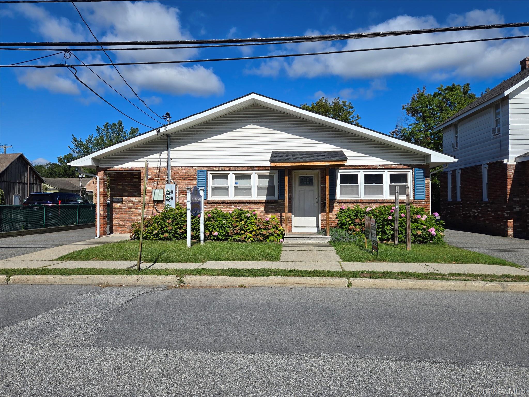 Bungalow-style home with brick siding