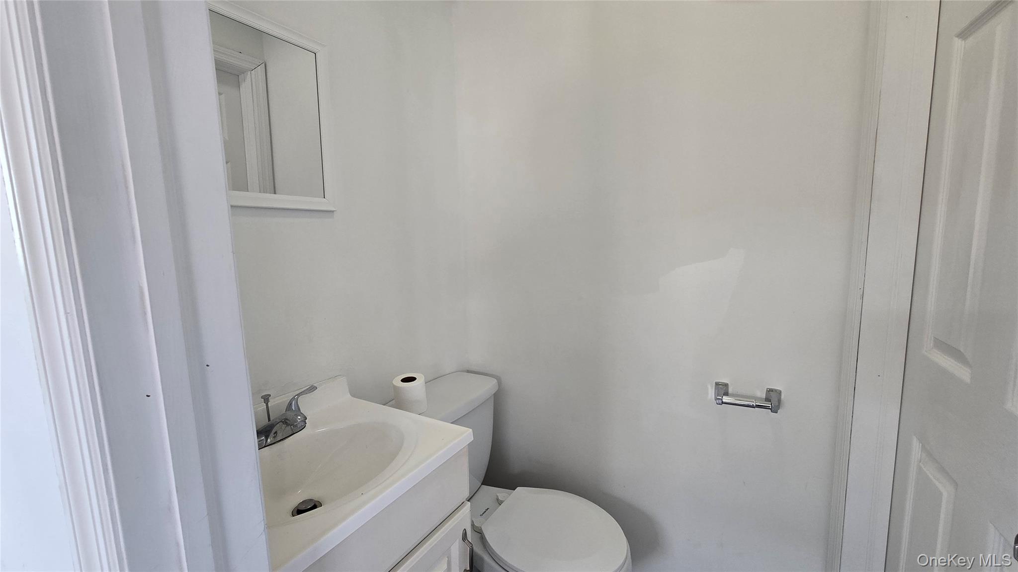 Half bath with toilet and vanity