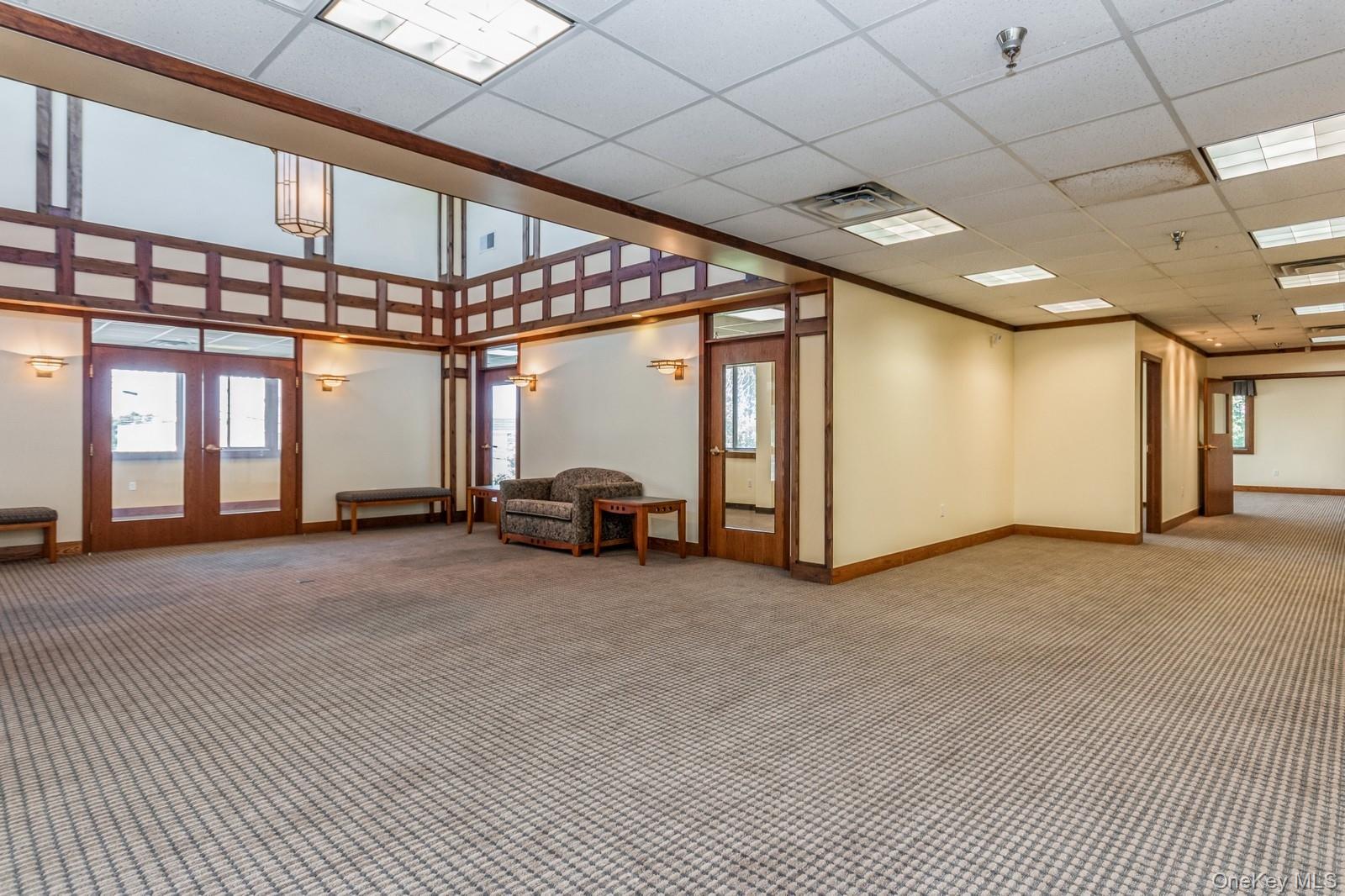 Central area surrounded by 6 executive offices