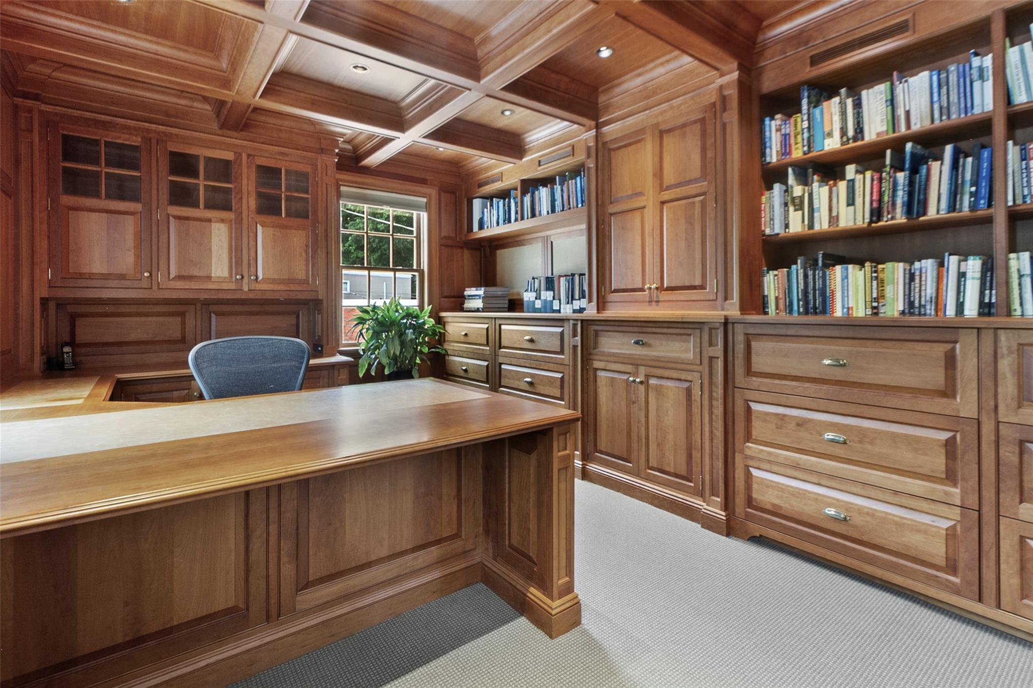 Office #1 features custom bookshelves and media center.