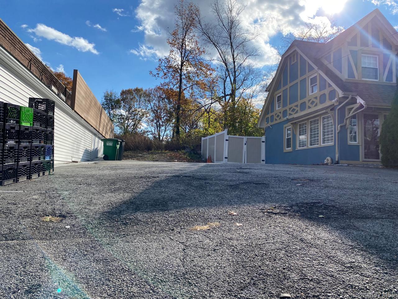View of property exterior with a gate