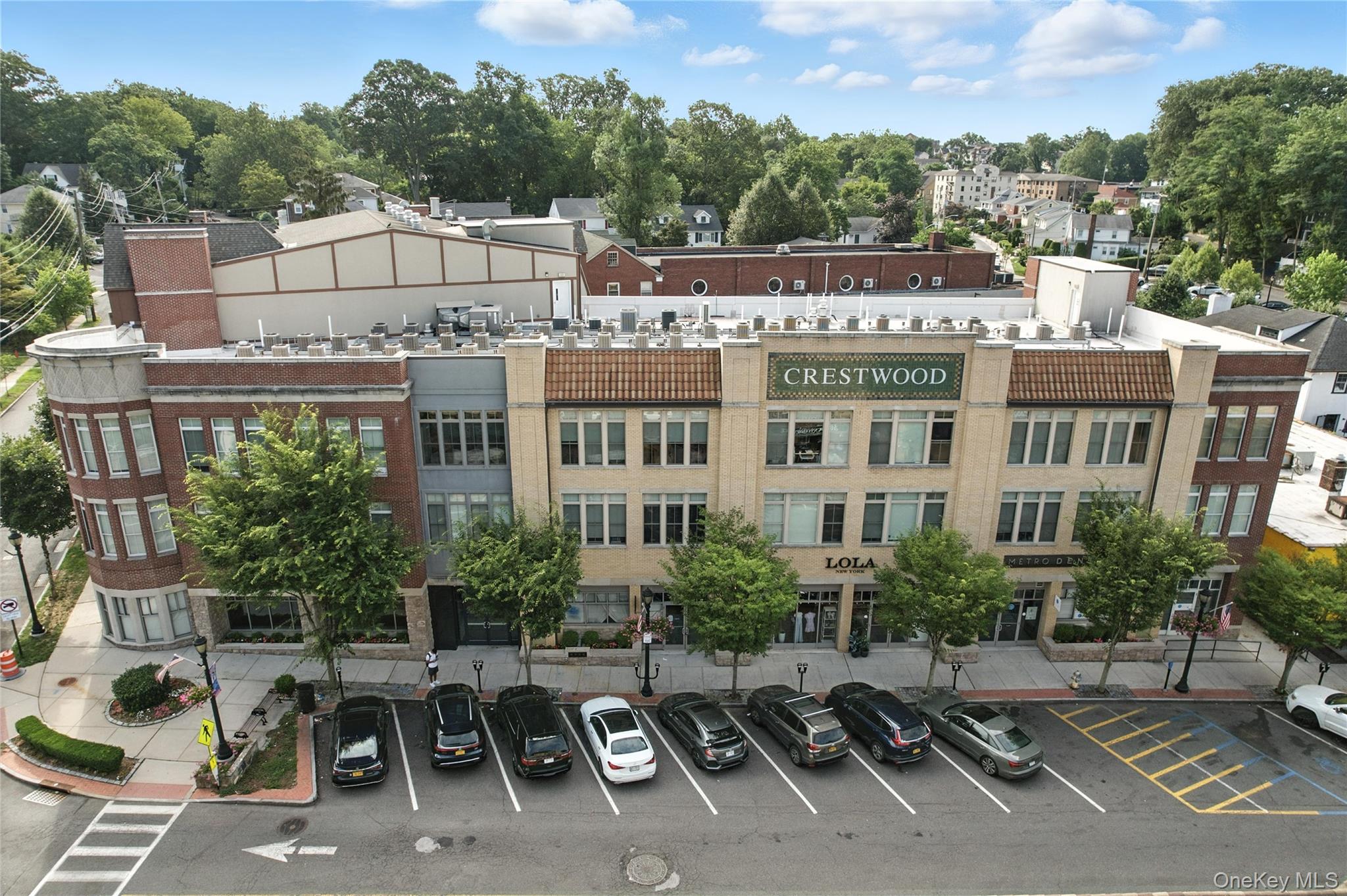 View of property with uncovered parking