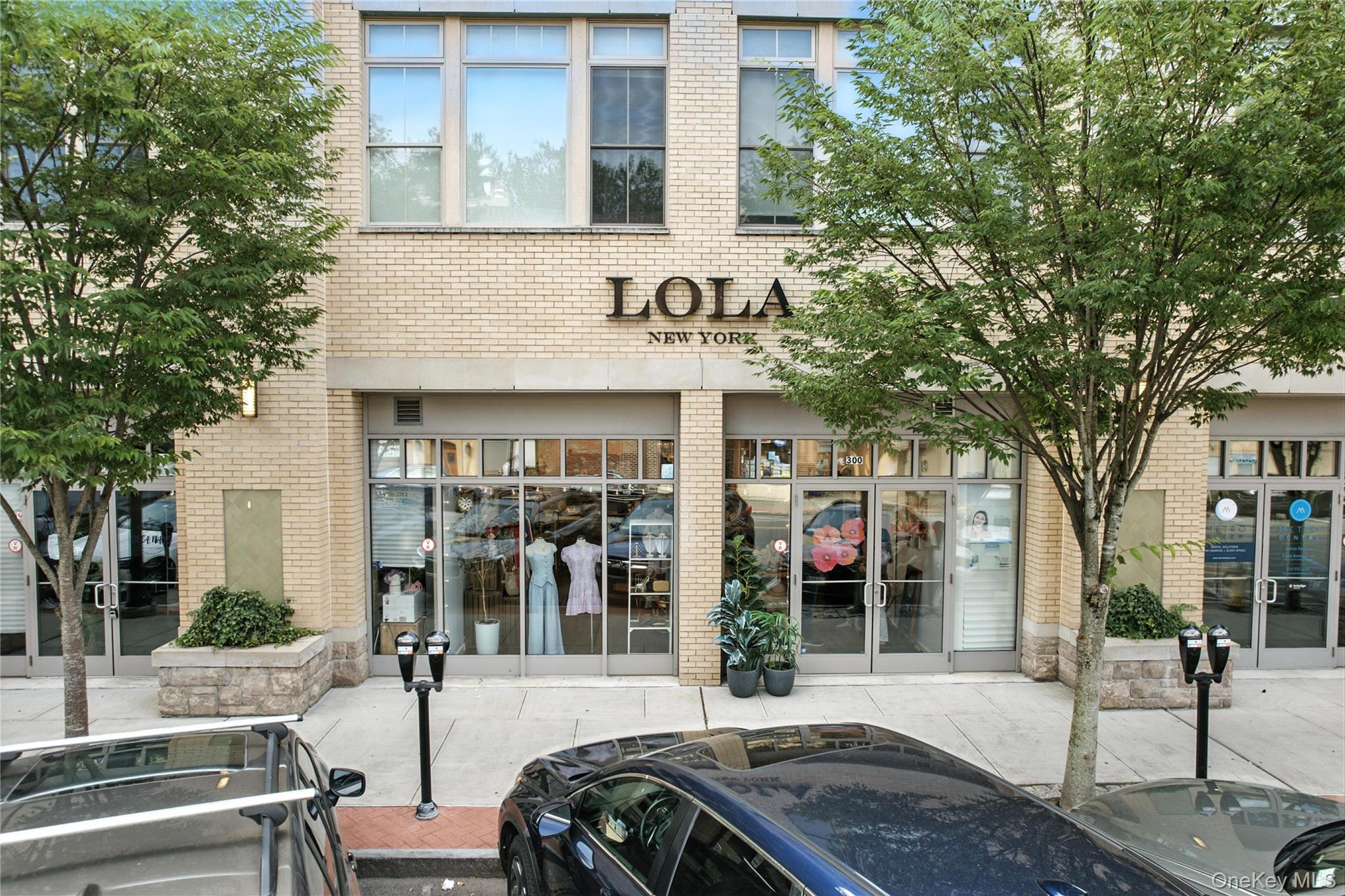 View of property with uncovered parking