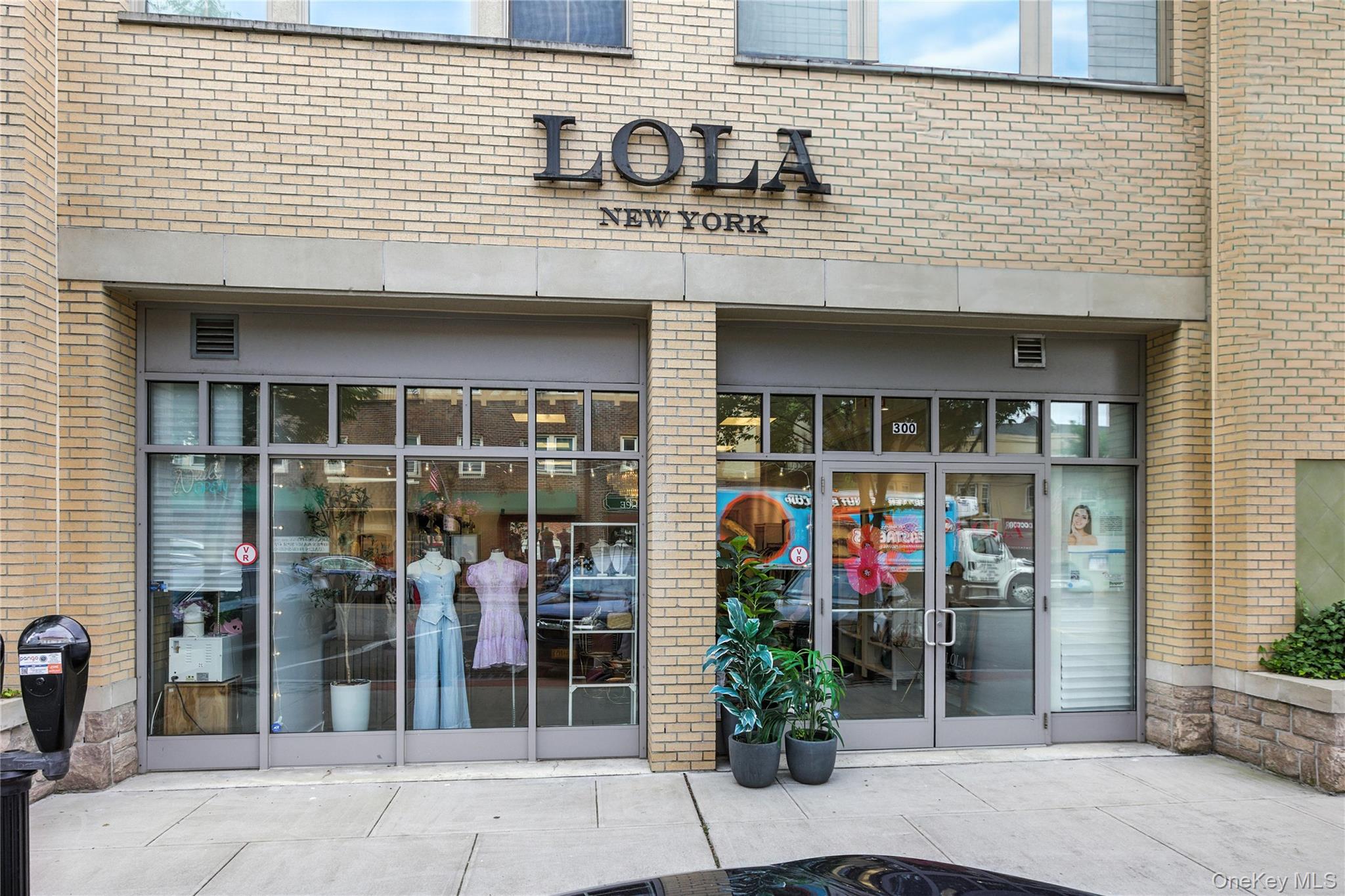 Property entrance featuring brick siding