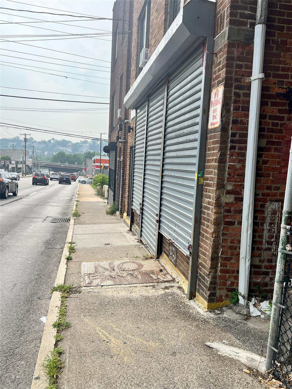 View of side of home featuring brick siding